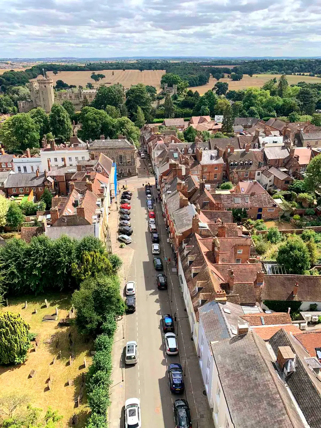 Looking down from St Mary's church tower onto Church Street, running between the tiled rooftops of the old town